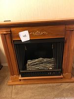 Front view of Jensen wood surround and metal firebox