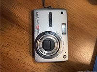 Silver Pentax Optio A10 digital camera showing front and lens details