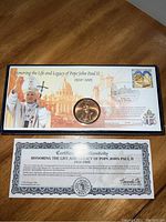 Full view of the commemorative coin display and certificate of authenticity.