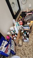 Bathroom countertop with health, hygiene, makeup, perfume bottles, and Dr Teal's soak bags visible, showing layout and variety of products.