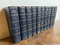 Front view of 10 Rex Beach Yukon Edition hardcover books arranged vertically showing titles and branding on spines.