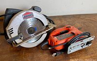 Both Jobmate circular saw and Black and Decker jigsaw side by side, showing overall condition and size comparison.