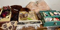 Overview of all vintage theatrical costumes, accessories, and makeup case.