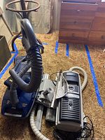 Electrolux 2100 canister vacuum showing body and hose assembly.