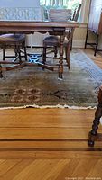 Rug positioned under dining table showing overall size and color