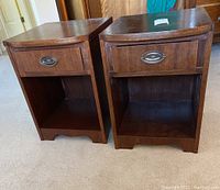 Two matching wooden night stands placed side by side showing front and sides.