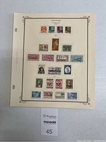 Single page of Danish postage stamps mounted in designated spots, various colors and designs.