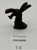 Full front view of cast iron donkey head bottle opener showing shape and detail.