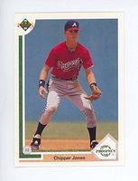 Front view of 1991 Upper Deck Chipper Jones rookie card, showing player in defensive stance in Atlanta Braves uniform with card branding and number visible.