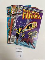 Photo showing all five New Mutants comic books stacked with front covers visible