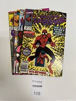 Five Spider-Man comic books stacked showing front covers including Vol.1 No.341 Nov 1990 and No.188 Jan 1979 at top