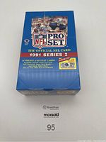 Front image of sealed blue box of NFL Pro Set 1991 Series I football cards showing branding and promotional text.