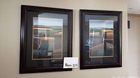Pair of abstract framed prints by Carelli, Terra II, hanging on a wall, clearly showing the double matting and dark wooden frames.