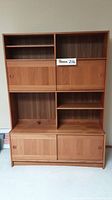 Frontal view of assembled bookcase hutch showing upper shelves and lower cabinets.