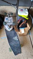 Overview showing two skateboards, cooler and glove box