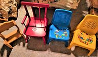 Four children's chairs shown from above and front angles including two plastic chairs with cartoon characters, one red-painted wooden rocking chair, and one unfinished small pine doll chair.