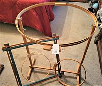 Large and smaller wooden quilting frames in different shapes, all free-standing or laptop size.