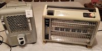 Two electric space heaters side by side showing size and design comparison