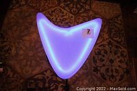 Top view of glowing blue neon Star Trek emblem shaped table top, showing the triangular shape and emblem form.