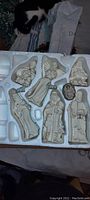 Christmas nativity figurines arranged in styrofoam packaging with one piece missing as per seller description