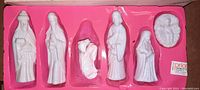 Porcelain nativity figures in original pink molded plastic tray