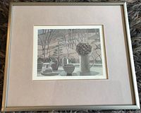 Full view of framed still life print showing multiple ceramic vessels and plants in the background.
