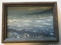 Original framed acrylic painting by Mary Auden depicting seascape with waves, rocky shore, lighthouse and buoy in distance.