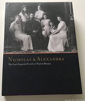 Front cover of the book showing a black and white photograph of the imperial family and title text.