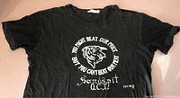 Front view of vintage black T-shirt with tiger graphic and text from Ed's Meatmarket