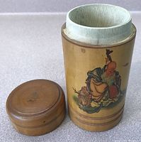 Open view showing interior bamboo surface and detached lid alongside the container with painted Confucius illustration visible.