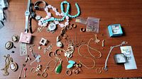 Overview of various costume jewelry items on wooden surface