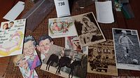 Photo showing several Royal Family themed bookmarks and postcards spread on a surface including caricature, royal portrait, and historical photos.