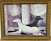Front view of ornate gold wood frame with greyhound art showing two dogs lying down