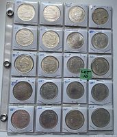 Binder page showing obverse of Morgan silver dollars in 2×2 holders with handwritten dates