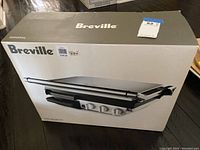 Original box of Breville indoor electric grill 800GRXL showing full packaging with product image and model number.