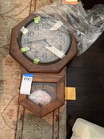 Full clock including lower wooden framed glass panel with 'REGULATOR' lettering, shows octagonal shape and wood grain finish.