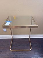 Front view of glass top and metal frame side table