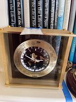 Front view of Seiko mantle clock showing the world time dial with major cities listed and clock hands.