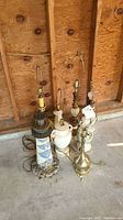 Lamps and garden decor grouped close showing size and details of bases and cords