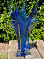 Full front view of the blue and aqua spiked glass vase showing overall organic form