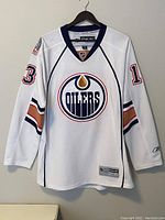Front view showing the Oilers logo and number 13 on the sleeve.