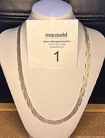 Front view of textured silver chain necklace displayed on bust