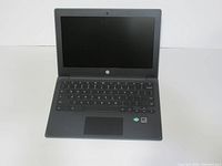 Front view of HP Chromebook 11A G8 showing keyboard, trackpad, and display off.