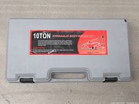 Closed gray plastic case with label showing kit description and capacity