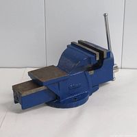 Side and front view of the blue fixed-base 6 inch bench vise on white background