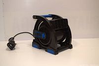 Front angled view of the black and blue Master Craft utility blower showing the control knob, grounded outlets, and handle.