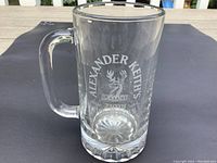 Clear glass beer stein front showing etched Alexander Keith's branding commemorating 210th birthday