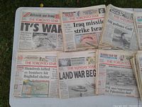 Layout of multiple Toronto Star newspapers from January 1991 with major Persian Gulf War headlines such as "IT'S WAR", "Iraq missile strike Israel", "Oil pollutes Gulf", "Hundreds killed as bombers hit Baghdad shelter", and "Land War Begins".