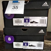 Two Adidas shoe boxes showing size 8 Courtset sneakers with UPC labels and Costco item numbers.