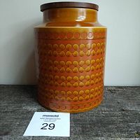 Full front view of large vintage Hornsea Saffron ceramic canister with wooden lid, showing the floral pattern and overall shape